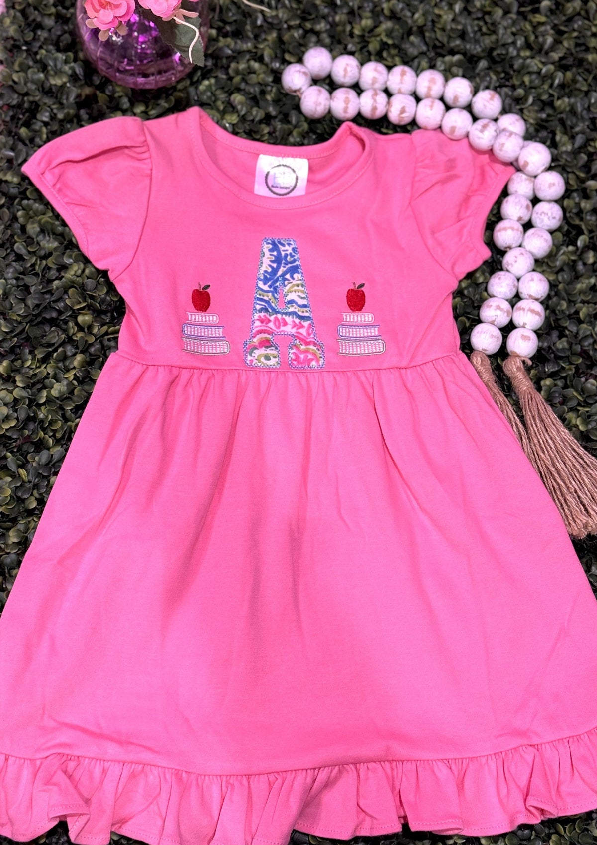Pink ruffle girls dress with personalized school-themed embroidery