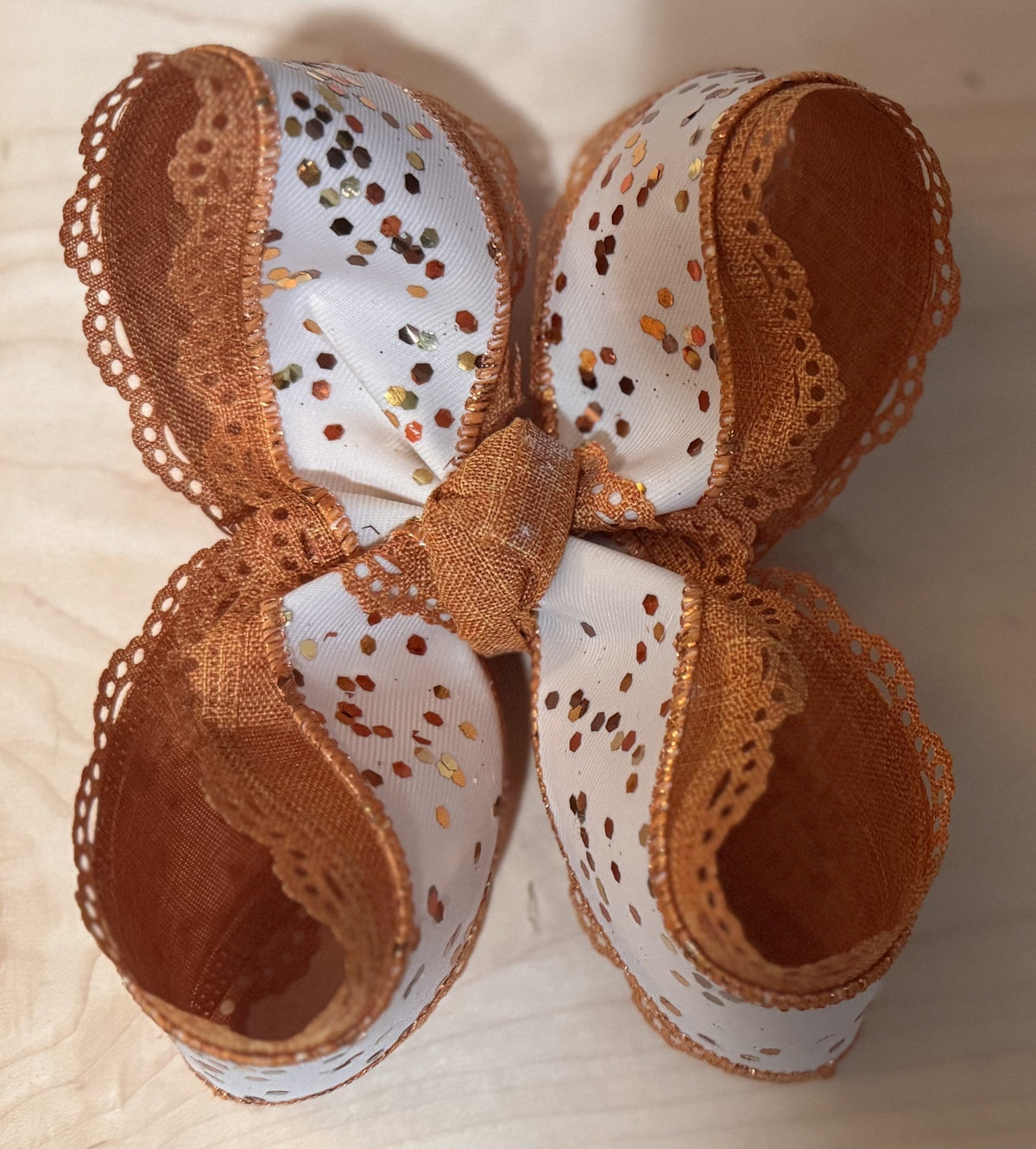 Brown and cream handmade bow with scalloped ribbon edging