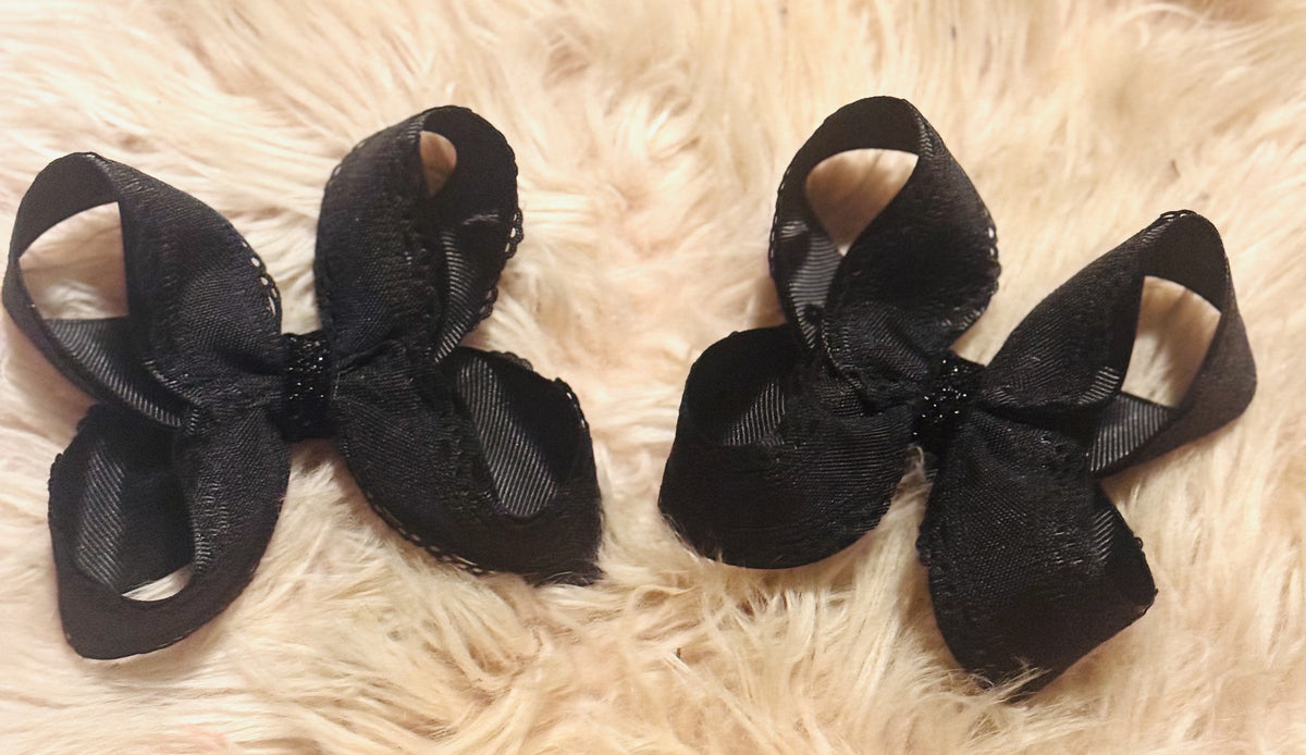 Set of black handmade bows with pearl embellishments