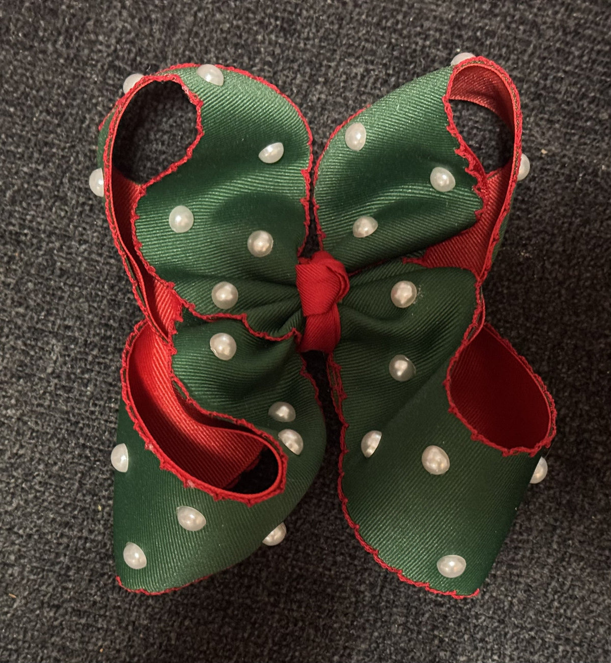 Green and red holiday handmade bow decorated with pearl accents