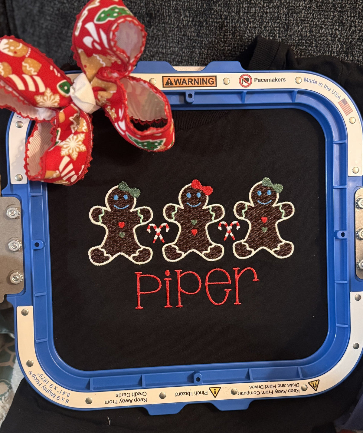 Gingerbread family embroidery personalized for Piper with a coordinating holiday bow