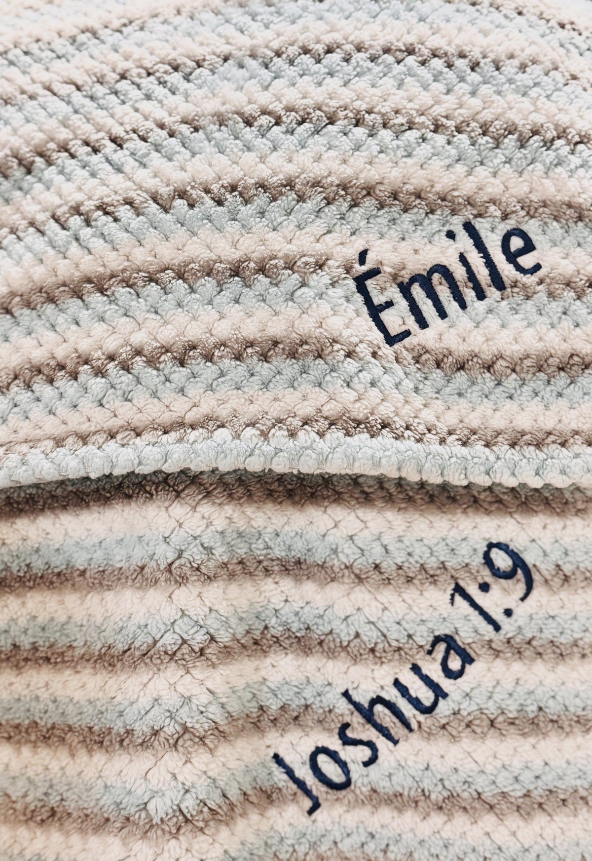 Striped knit keepsake blanket personalized with the names Emile and Joshua