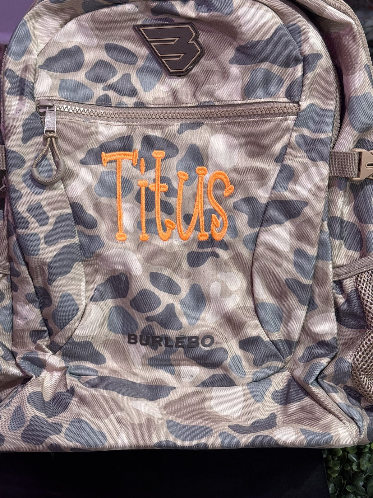 Camouflage backpack personalized with the name Titus