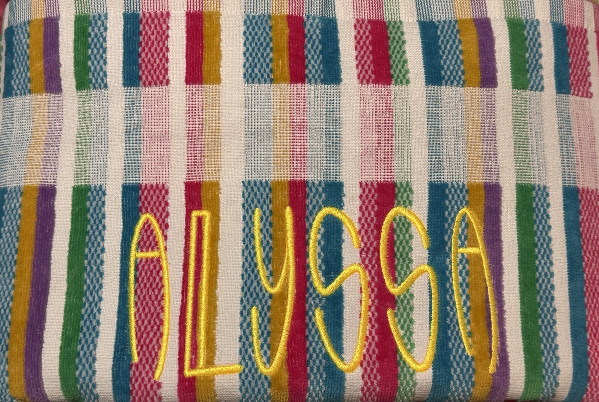 Multicolor striped towel personalized with a bright embroidered name