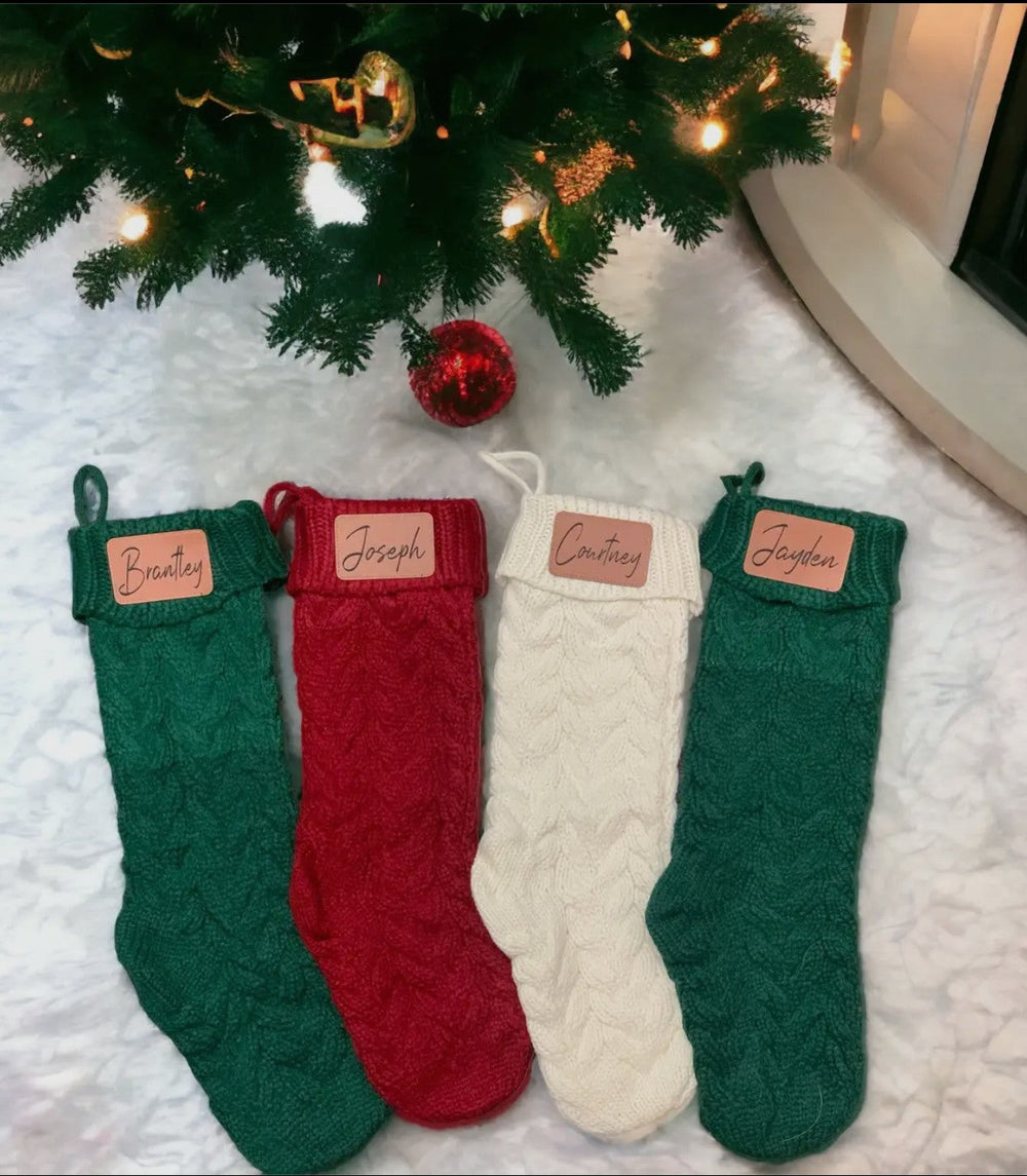 Green red and cream knit Christmas stockings personalized with embroidered name patches