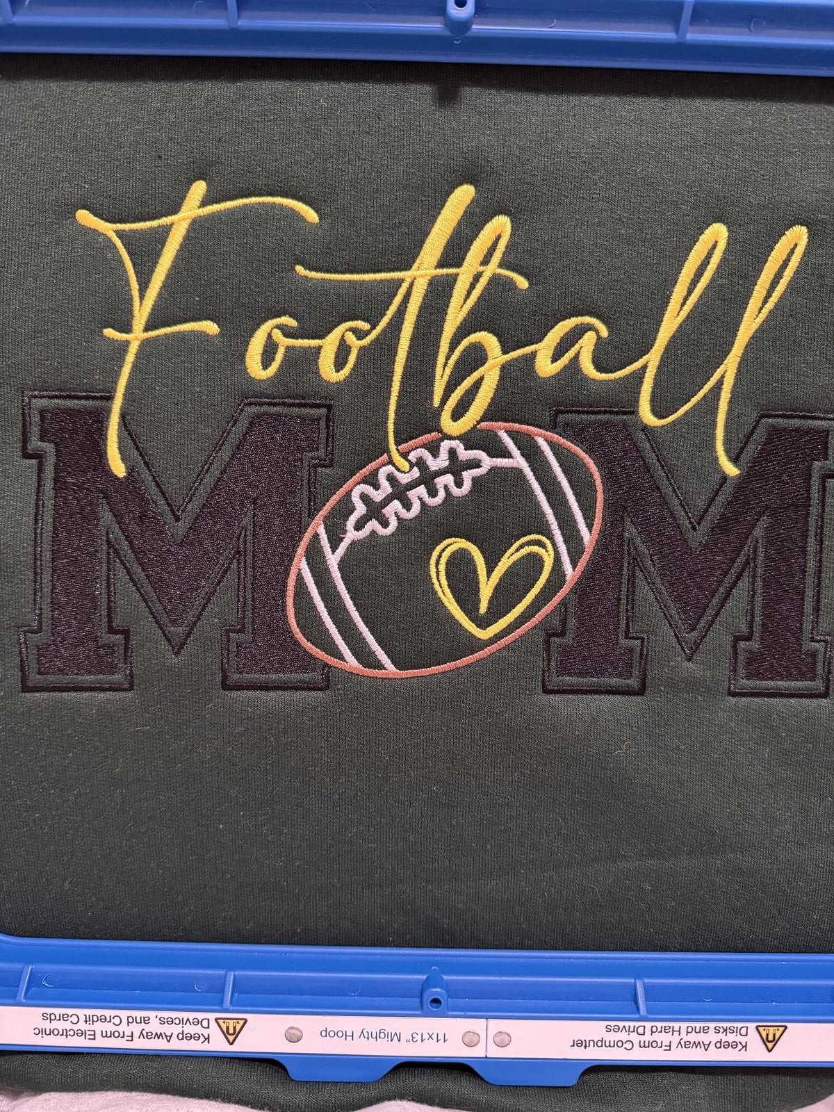 Dark fabric with Football Mom applique and football embroidery